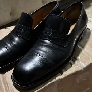 Salvatore Ferragamo black leather loafers.